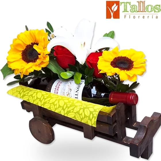 Arreglo floral con rosas rojas girasoles lirio blanco y vino en base decorativa de madera ideal para regalo de amistad elegante con entrega a domicilio en Lima