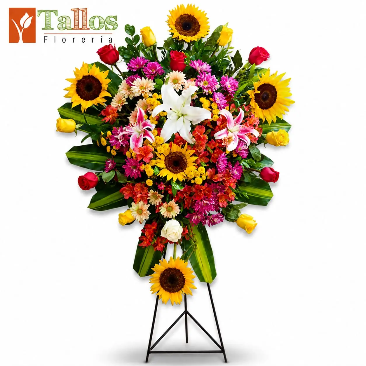Arreglo floral de condolencias colorido con rosas de colores girasoles y lirios para velorios elegante y respetuoso con entrega a domicilio en Lima