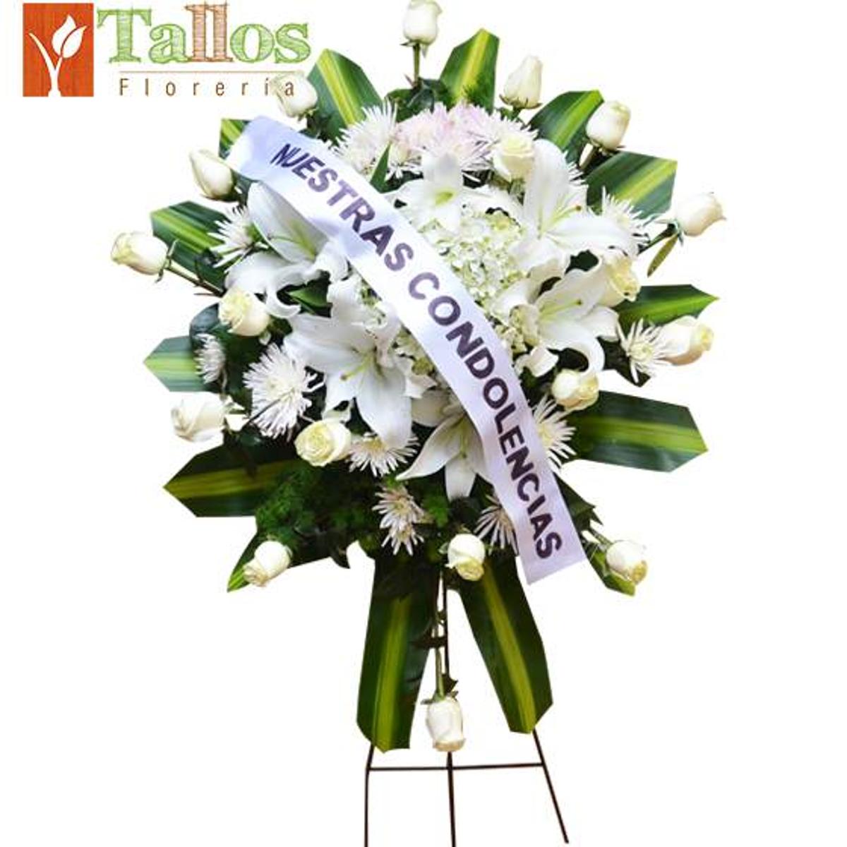Arreglo floral de condolencias con rosas blancas lirios blancos y hortensias para velorio elegante y sobrio con entrega a domicilio en Lima